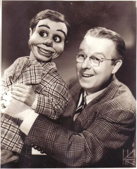 Ventriloquist holding a puppet